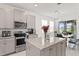 Bright kitchen with stainless steel appliances and a granite island at 2800 Cello Ln, Kissimmee, FL 34741