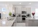 Modern kitchen featuring stainless steel appliances and granite countertops at 2800 Cello Ln, Kissimmee, FL 34741