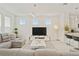 Stylish living room with a gray sectional sofa and open floor plan at 2800 Cello Ln, Kissimmee, FL 34741