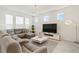 Bright living room featuring a sectional sofa and modern decor at 2800 Cello Ln, Kissimmee, FL 34741