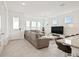 Open-concept living room boasts natural light, neutral tones, and tile flooring at 2800 Cello Ln, Kissimmee, FL 34741