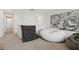 Upstairs loft area featuring neutral carpet, modern artwork, and comfortable seating at 2800 Cello Ln, Kissimmee, FL 34741