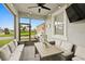 Cozy screened lanai with comfortable seating and a ceiling fan at 2800 Cello Ln, Kissimmee, FL 34741