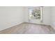 Bright, airy bedroom with tile floors and a large window overlooking the front yard at 411 Boxwood Dr, Davenport, FL 33837