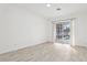 A bright living room with tile flooring and a sliding glass door to the pool at 411 Boxwood Dr, Davenport, FL 33837