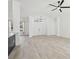 Spacious, open-concept living area with tile floors and modern lighting at 411 Boxwood Dr, Davenport, FL 33837