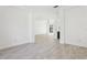 Bright, open-concept living area with tile floors, modern lighting, and neutral color scheme at 411 Boxwood Dr, Davenport, FL 33837