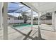 Screened-in patio with a refreshing in-ground pool, great for summer fun at 411 Boxwood Dr, Davenport, FL 33837