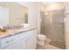 Bright bathroom featuring granite countertop, glass shower and neutral decor at 4138 Lana Ave, Davenport, FL 33897