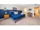 Spacious bedroom with a queen bed, nautical-themed decor, and a comfortable work area at 4138 Lana Ave, Davenport, FL 33897