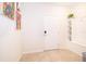 Bright entryway with neutral tile flooring, built-in shelving and a white front door at 4138 Lana Ave, Davenport, FL 33897