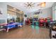 Community clubhouse gaming zone with a variety of modern arcade games, air hockey, and modern decor at 4138 Lana Ave, Davenport, FL 33897