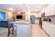 Open kitchen featuring a granite island, stainless steel appliances, and barstool seating at 4138 Lana Ave, Davenport, FL 33897