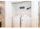 Convenient laundry room with a full-size washer and dryer, and ample shelving at 4138 Lana Ave, Davenport, FL 33897