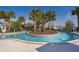 Community lazy river with tropical landscaping for a relaxing vacation lifestyle at 4138 Lana Ave, Davenport, FL 33897