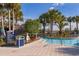 Community lazy river with 3-foot depth and tropical landscaping for a relaxing vacation lifestyle at 4138 Lana Ave, Davenport, FL 33897