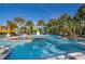 Community lazy river with tropical landscaping and multiple waterslides for a fun vacation lifestyle at 4138 Lana Ave, Davenport, FL 33897