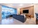 Living room featuring a comfortable couch, a wall-mounted TV, stylish decor, and pool views through sliding glass doors at 4138 Lana Ave, Davenport, FL 33897