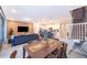 Dining and living area with modern decor open to kitchen and staircase at 4138 Lana Ave, Davenport, FL 33897
