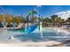 Community splash pad with kid-friendly water slide, fountains, and lounge chairs for a fun vacation lifestyle at 4138 Lana Ave, Davenport, FL 33897