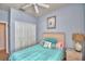 Charming bedroom boasts a comfortable bed and a spacious closet for ample storage at 500 Monroe Cir, Davenport, FL 33896
