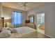 Comfortable bedroom with a bathroom and dresser with TV at 500 Monroe Cir, Davenport, FL 33896