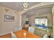 Comfortable living space with dining area, staircase, and sliding door access to the outdoors at 500 Monroe Cir, Davenport, FL 33896