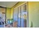 Relaxing covered patio features lush plants and sliding glass doors to the interior at 500 Monroe Cir, Davenport, FL 33896