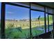 Inviting screened-in patio features a beautiful view of the expansive green backyard at 500 Monroe Cir, Davenport, FL 33896