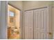 View from the hallway of the powder room with a toilet and vanity with storage at 500 Monroe Cir, Davenport, FL 33896