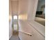 Bright staircase, with natural light and a glimpse of the bedroom at 500 Monroe Cir, Davenport, FL 33896