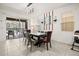 Bright dining room with patio access and a modern chandelier at 5117 Oakbourne Ave, Davenport, FL 33837