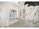 Hallway with unique wall accents, decorative mirror, tiled floors and archway at 5117 Oakbourne Ave, Davenport, FL 33837