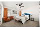 Bright main bedroom featuring a plush queen bed, carpeted floor, and neutral paint at 5117 Oakbourne Ave, Davenport, FL 33837