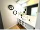 Bright bathroom featuring a modern vanity with a vessel sink and decorative mirrors at 5245 W Irlo Bronson Memorial Hwy # 192, Kissimmee, FL 34746