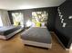 Modern bedroom featuring two beds with gray bedding and stylish bamboo themed art at 5245 W Irlo Bronson Memorial Hwy # 192, Kissimmee, FL 34746