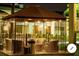 Outdoor lounge area with seating, tables, and lighting at 5245 W Irlo Bronson Memorial Hwy # 192, Kissimmee, FL 34746