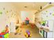 Bright, colorful playroom with shelving, various toys and an abundance of light at 5245 W Irlo Bronson Memorial Hwy # 192, Kissimmee, FL 34746