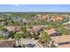 Attractive neighborhood with lovely homes, manicured landscaping, mature trees, and a tranquil lake in the background at 5512 Solterra Cir, Davenport, FL 33837