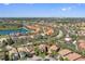 Picturesque community featuring well-kept homes, a peaceful lake, and recreational facilities, perfect for Gathering living at 5512 Solterra Cir, Davenport, FL 33837