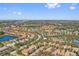 Sprawling community boasts lush green spaces, a serene lake, and amenities, creating an inviting neighborhood ambiance at 5512 Solterra Cir, Davenport, FL 33837