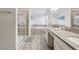 Luxurious bathroom includes a glass shower, soaking tub, double vanity, and natural light at 5512 Solterra Cir, Davenport, FL 33837