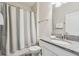 Bright bathroom with a single vanity, granite countertop, and shower-tub combination at 5512 Solterra Cir, Davenport, FL 33837
