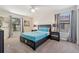 Comfortable bedroom with a neutral color scheme, carpeted floors, and windows for natural light at 5512 Solterra Cir, Davenport, FL 33837
