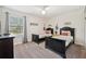 This is a bedroom with two beds, music-themed wall art, carpet, and a ceiling fan at 5512 Solterra Cir, Davenport, FL 33837