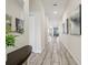 A hallway with tile flooring, neutral walls, and recessed lighting creates an inviting space at 5512 Solterra Cir, Davenport, FL 33837