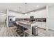 Modern kitchen featuring stainless steel appliances, a granite countertop, and a center island with seating at 5512 Solterra Cir, Davenport, FL 33837