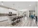 Open-concept kitchen featuring a center island with bar seating, stainless appliances and modern finishes at 5512 Solterra Cir, Davenport, FL 33837