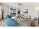Bright living room with plush seating and a view of the screened pool area for relaxation at 5512 Solterra Cir, Davenport, FL 33837
