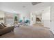 Neutral tones and versatile design of the living room provide a relaxing, inviting living area at 5512 Solterra Cir, Davenport, FL 33837